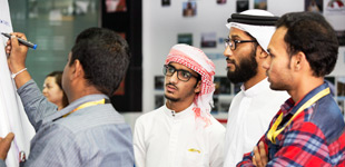 Four men working in Dubai