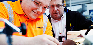 Two workers engaging in training