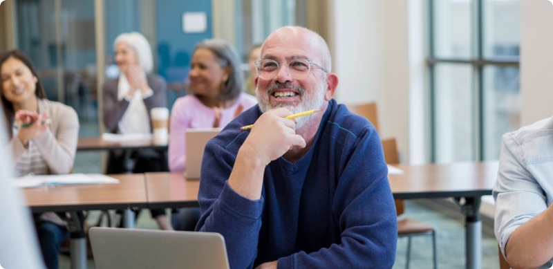 People seated in a classroom-style training session